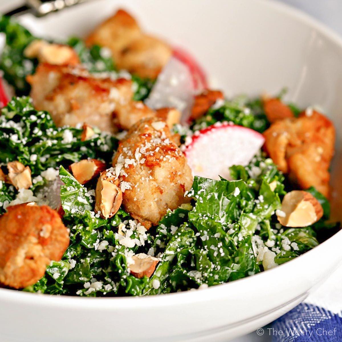 Chicken Caesar Salad with kale is lightened up with a reduced-fat caesar dressing. Great weeknight dinner!