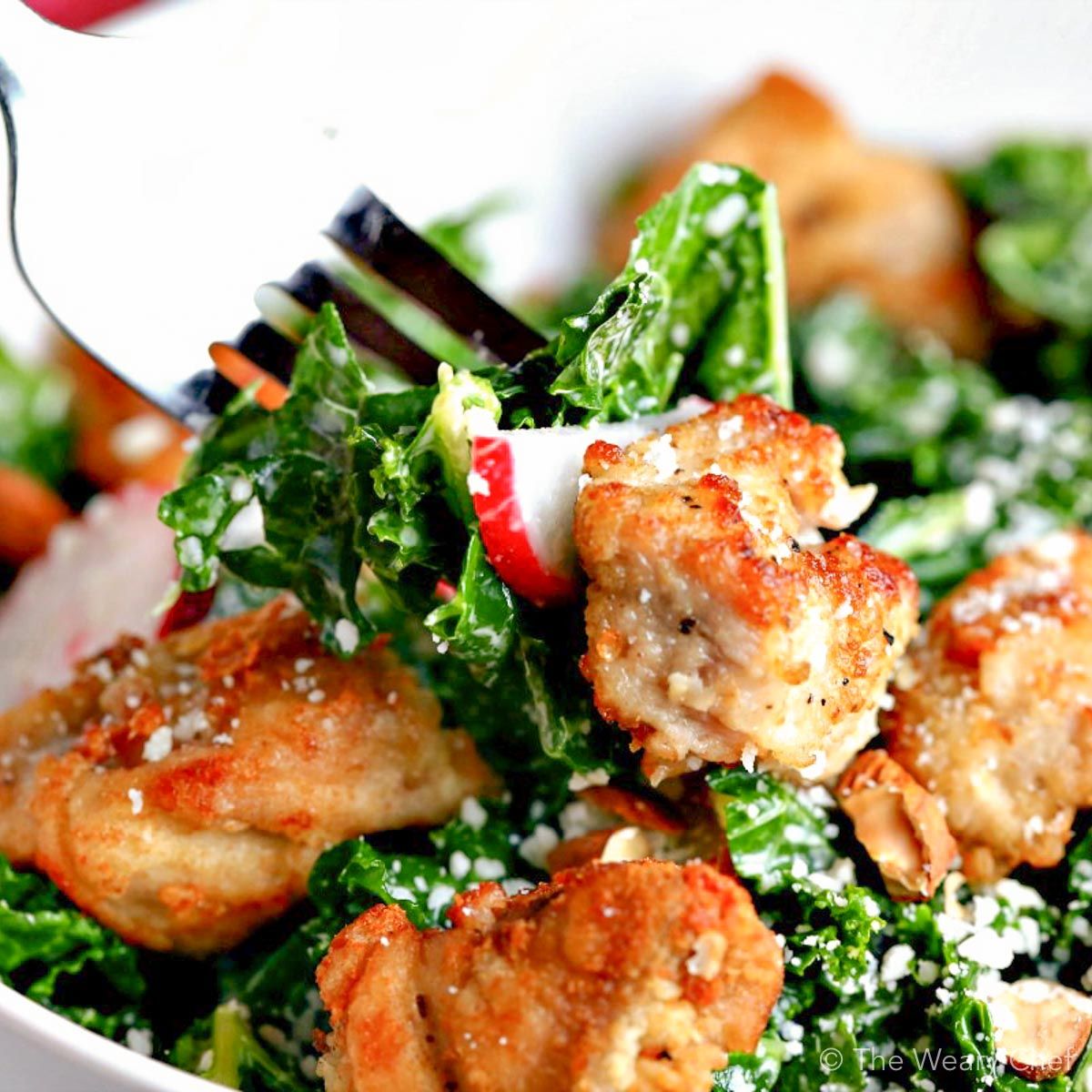 Chicken Caesar Salad with kale is lightened up with a reduced-fat caesar dressing. Great weeknight dinner!