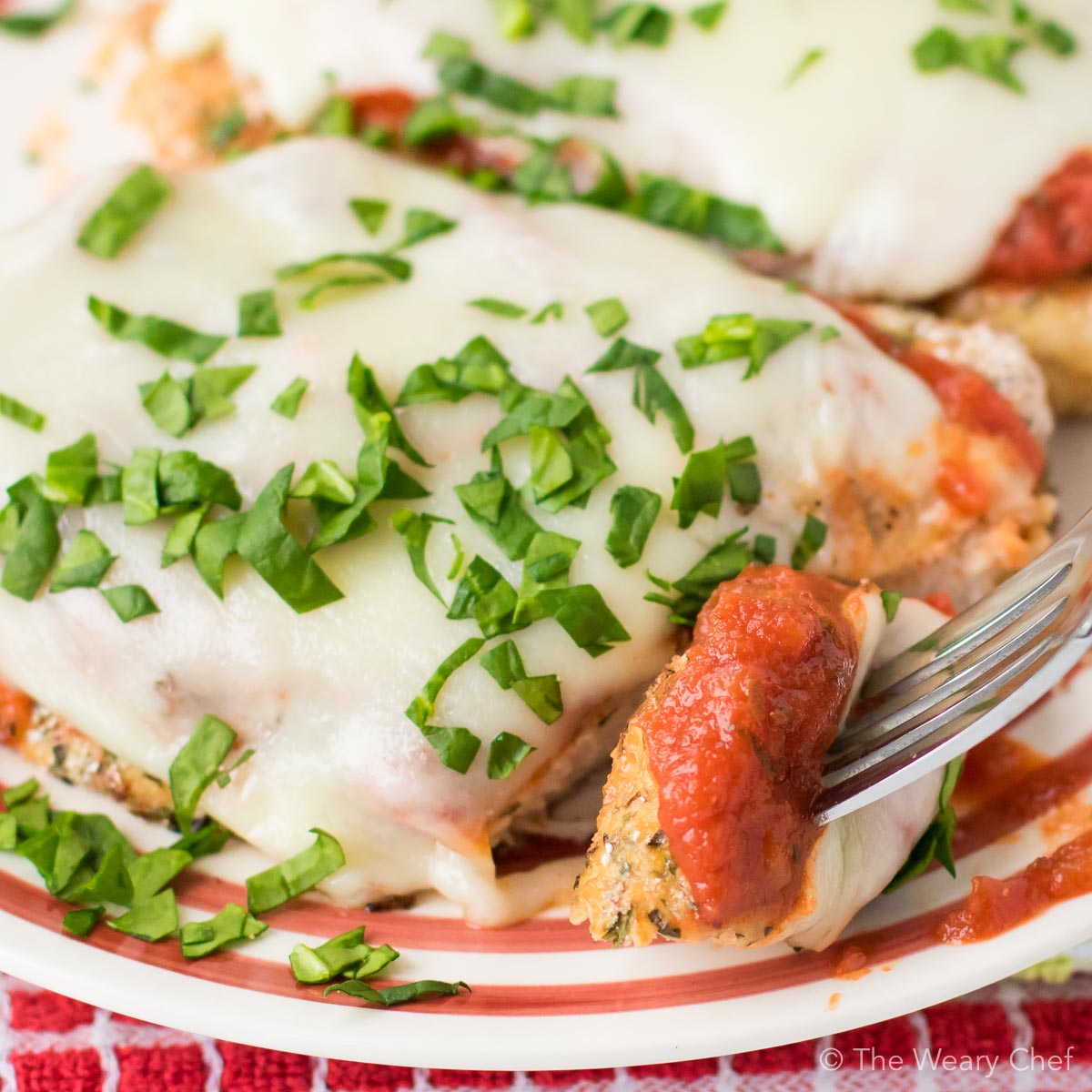 This Baked Chicken Parmesan is healthier, easier, and less messy than the classic version. Your family or guests will love this easy Italian dinner recipe!