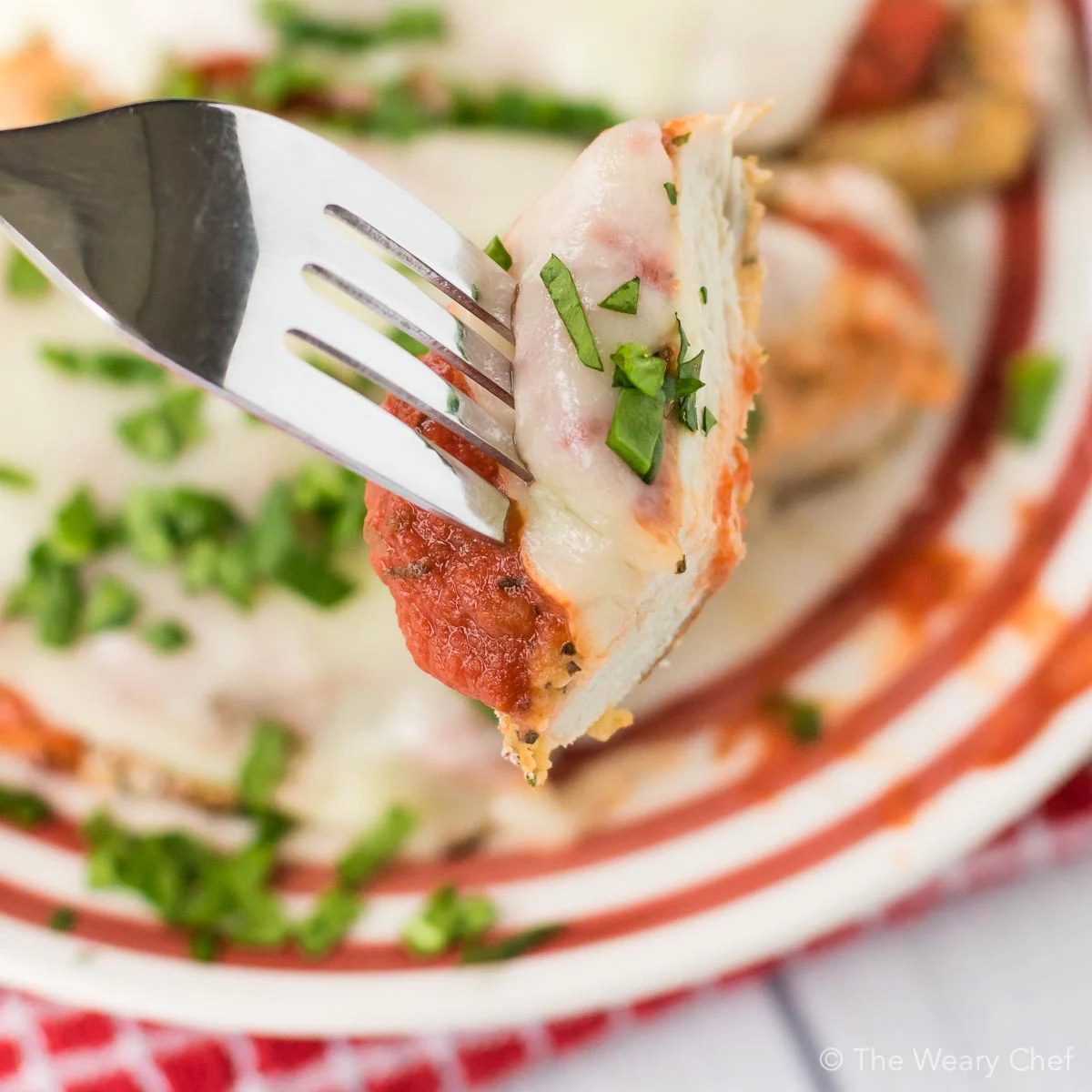 This Baked Chicken Parmesan is healthier, easier, and less messy than the classic version. Your family or guests will love this easy Italian dinner recipe!