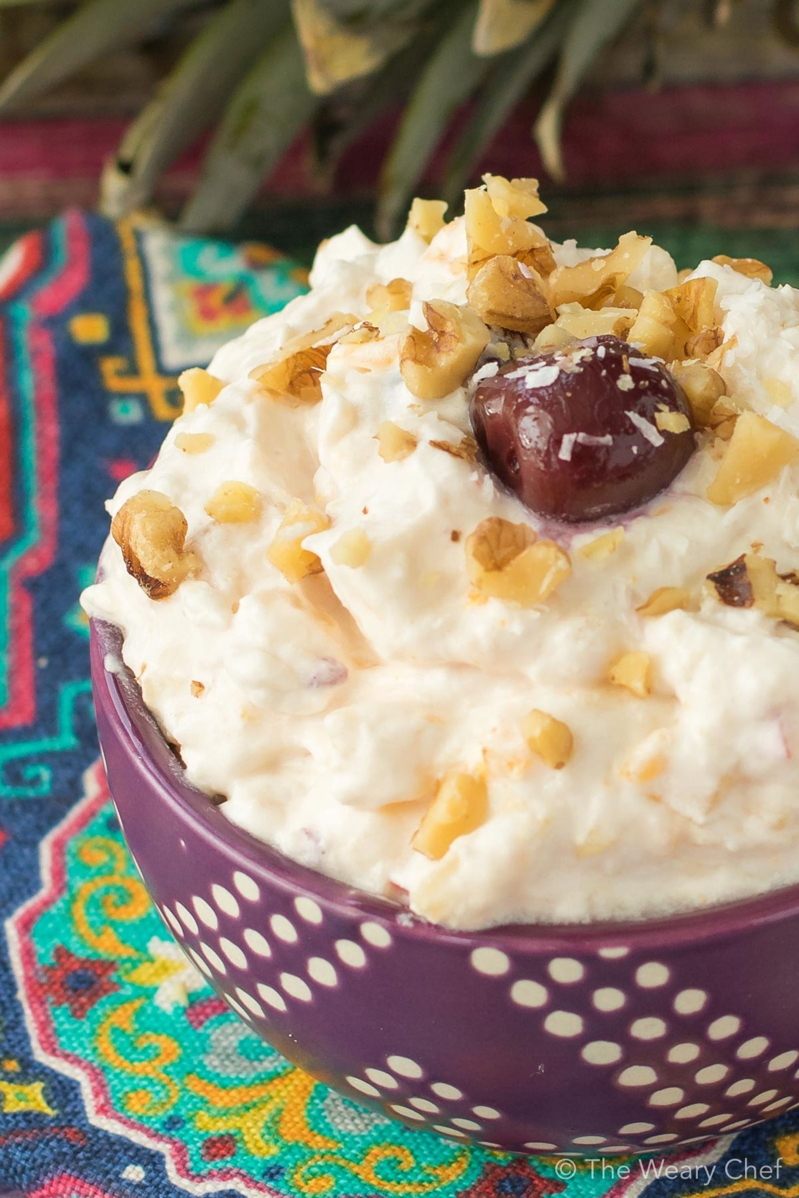 Ambrosia Fruit Salad is a classic easy dessert recipe! Add in canned or fresh fruits, and be a potluck hero!