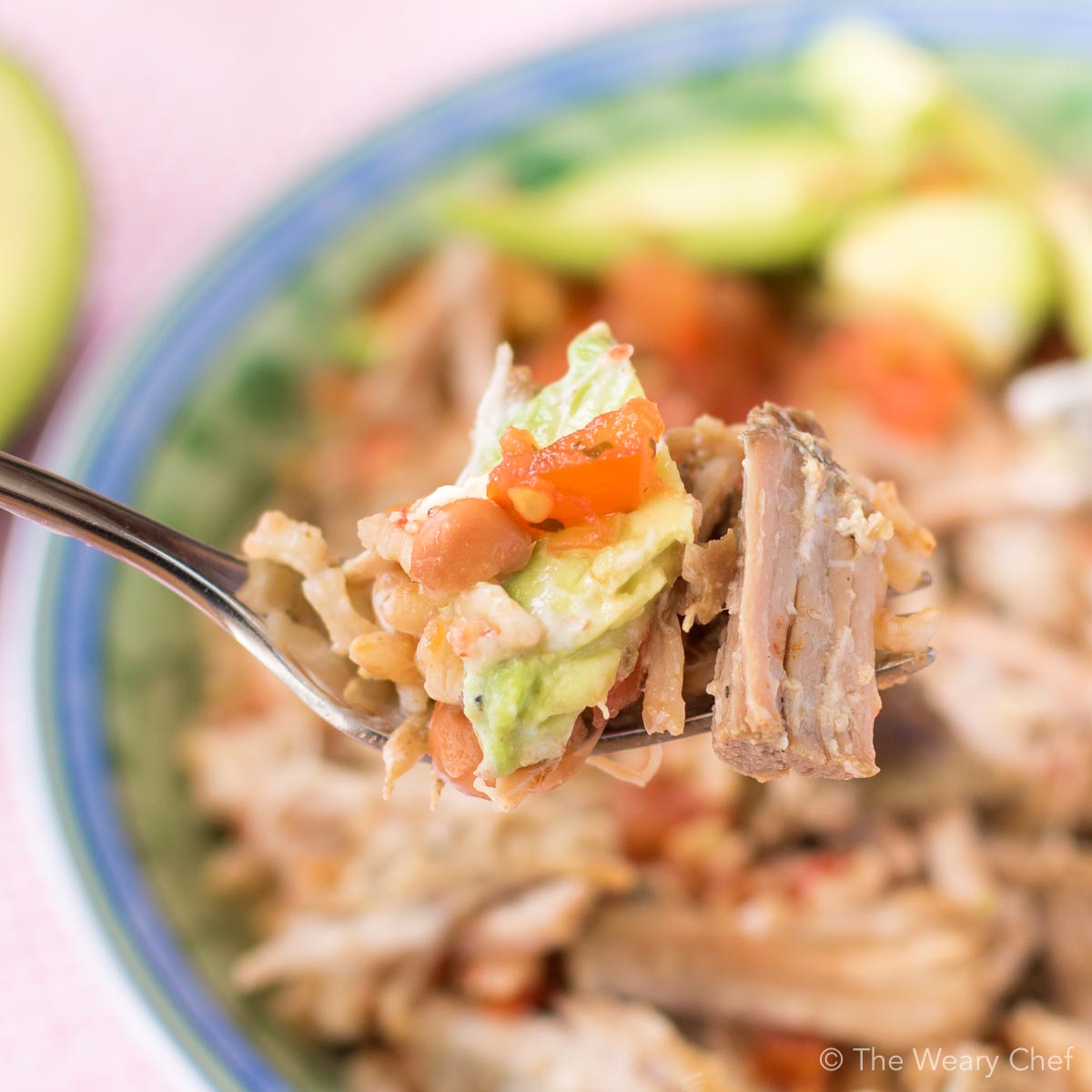 This very easy Mexican Pinto Beans and Rice topped with tender pork carnitas is delicious dinner the whole family will love! Prepare the pork in the slow cooker, and make the beans and rice in one pot in 15 minutes!