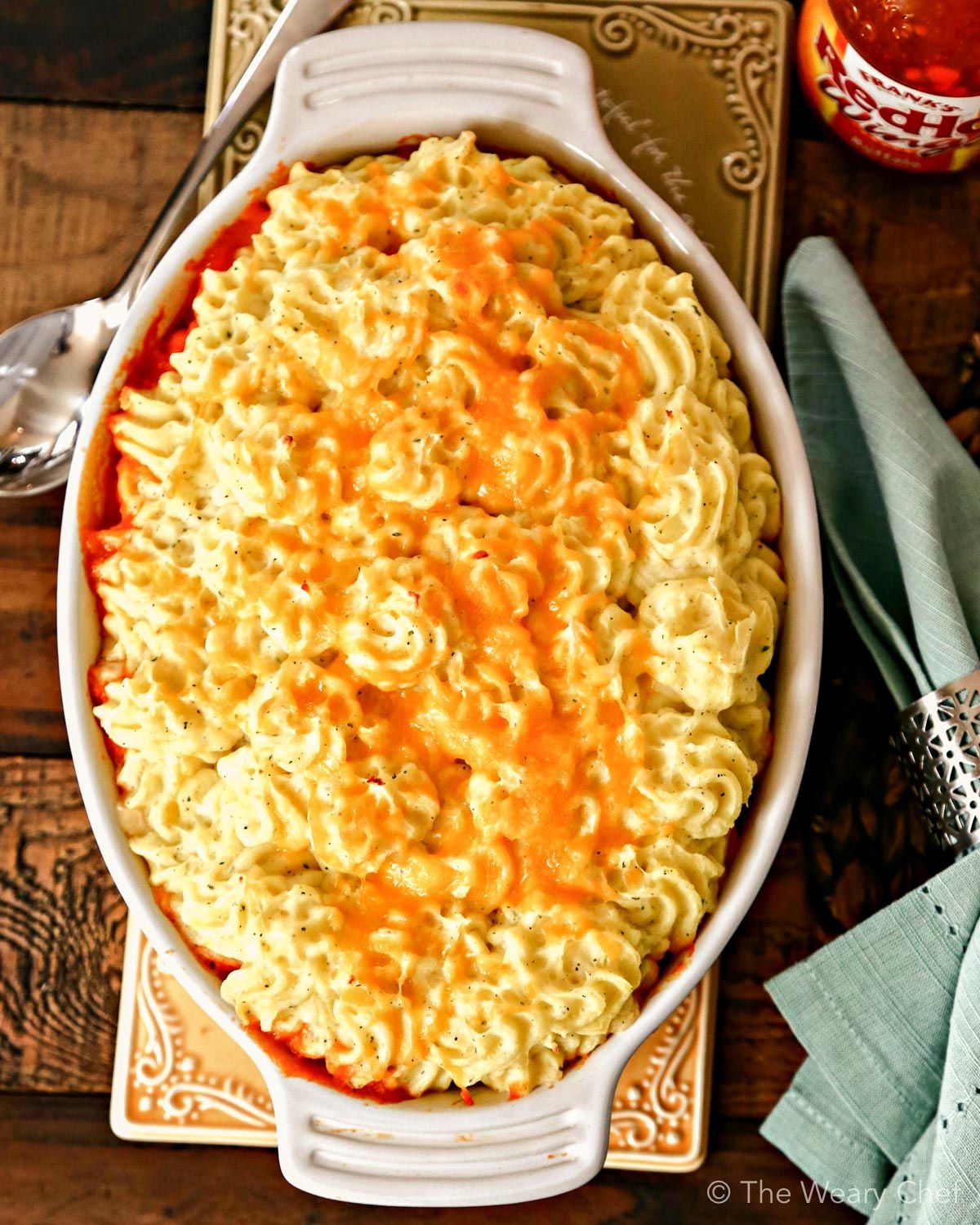 Classic Buffalo Chicken Dip is reinvented into a comforting family dinner—Buffalo Chicken Shepherd’s Pie with Ranch Mashed Potatoes!