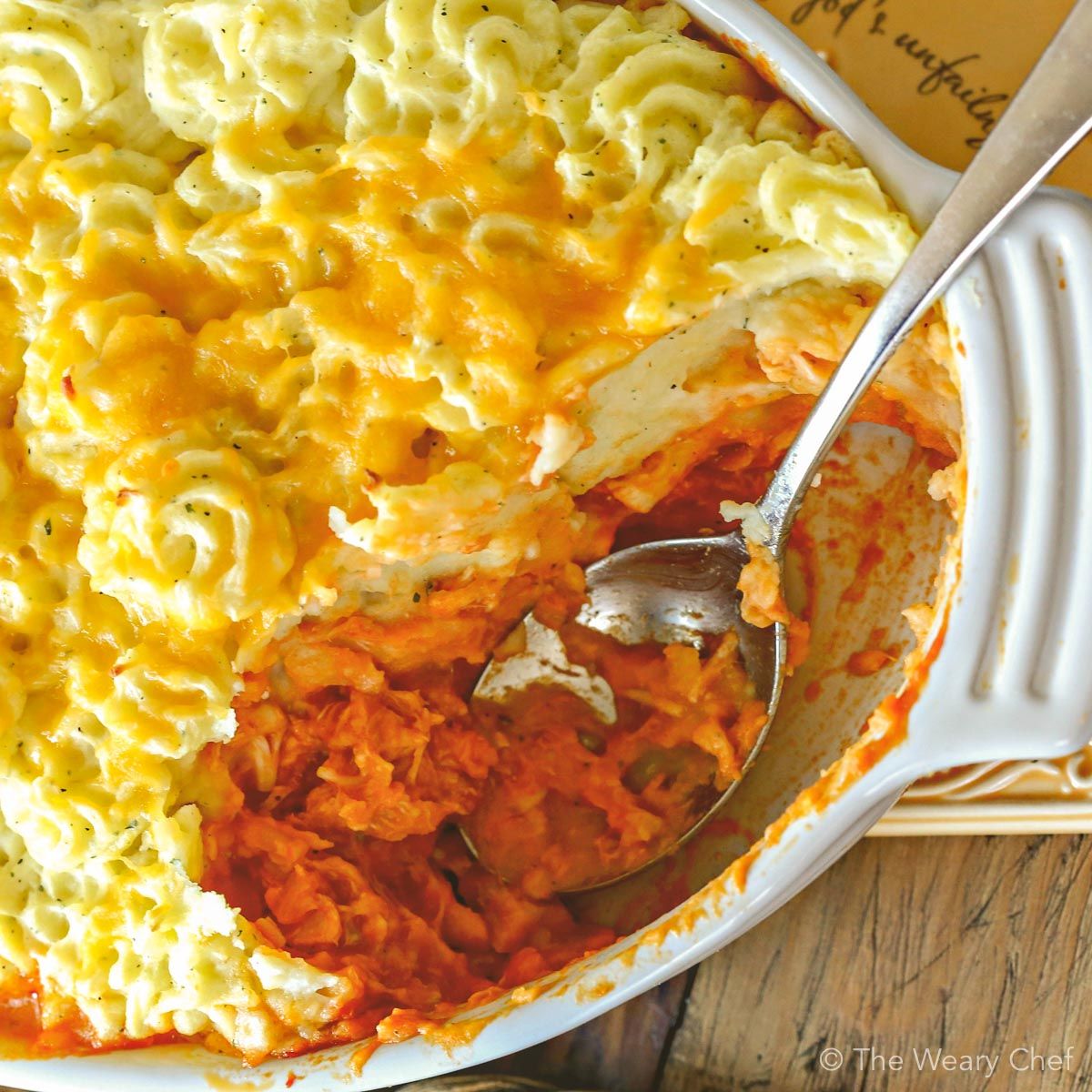 Classic Buffalo Chicken Dip is reinvented into a comforting family dinner—Buffalo Chicken Shepherd’s Pie with Ranch Mashed Potatoes!