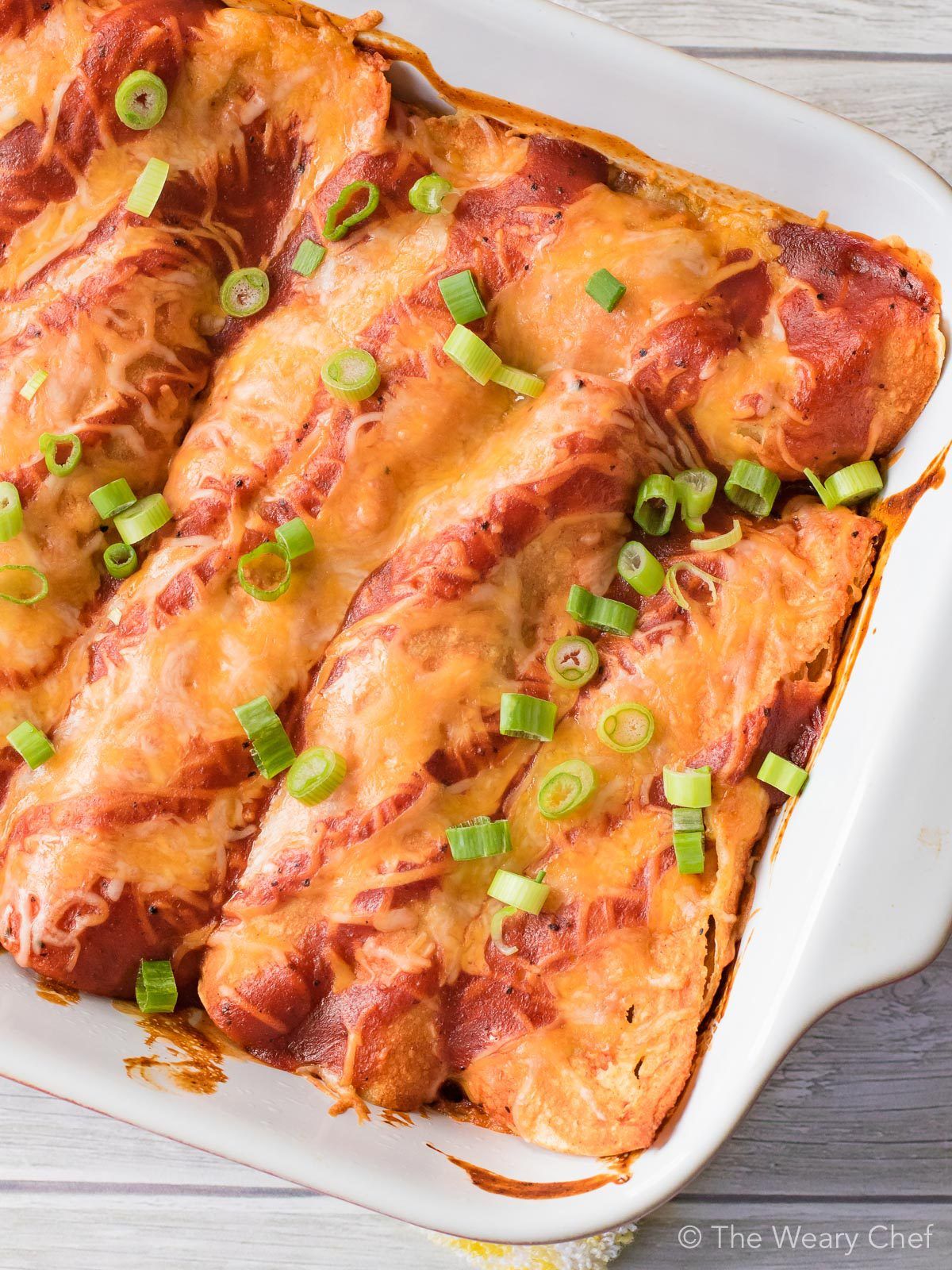 BBQ Brisket Enchiladas are the best way to enjoy your leftover brisket this Fourth of July! Make a low and slow beef brisket this weekend, and use the leftovers in this fast weeknight recipe.