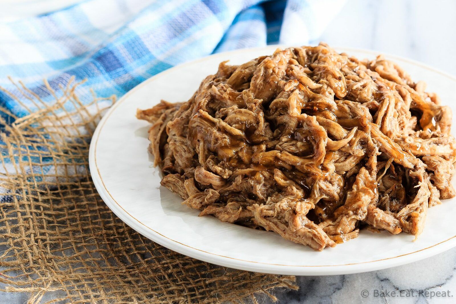 This tender maple pork tenderloin takes just minutes to get into the slow cooker and is amazing piled onto a soft roll for an easy dinner!