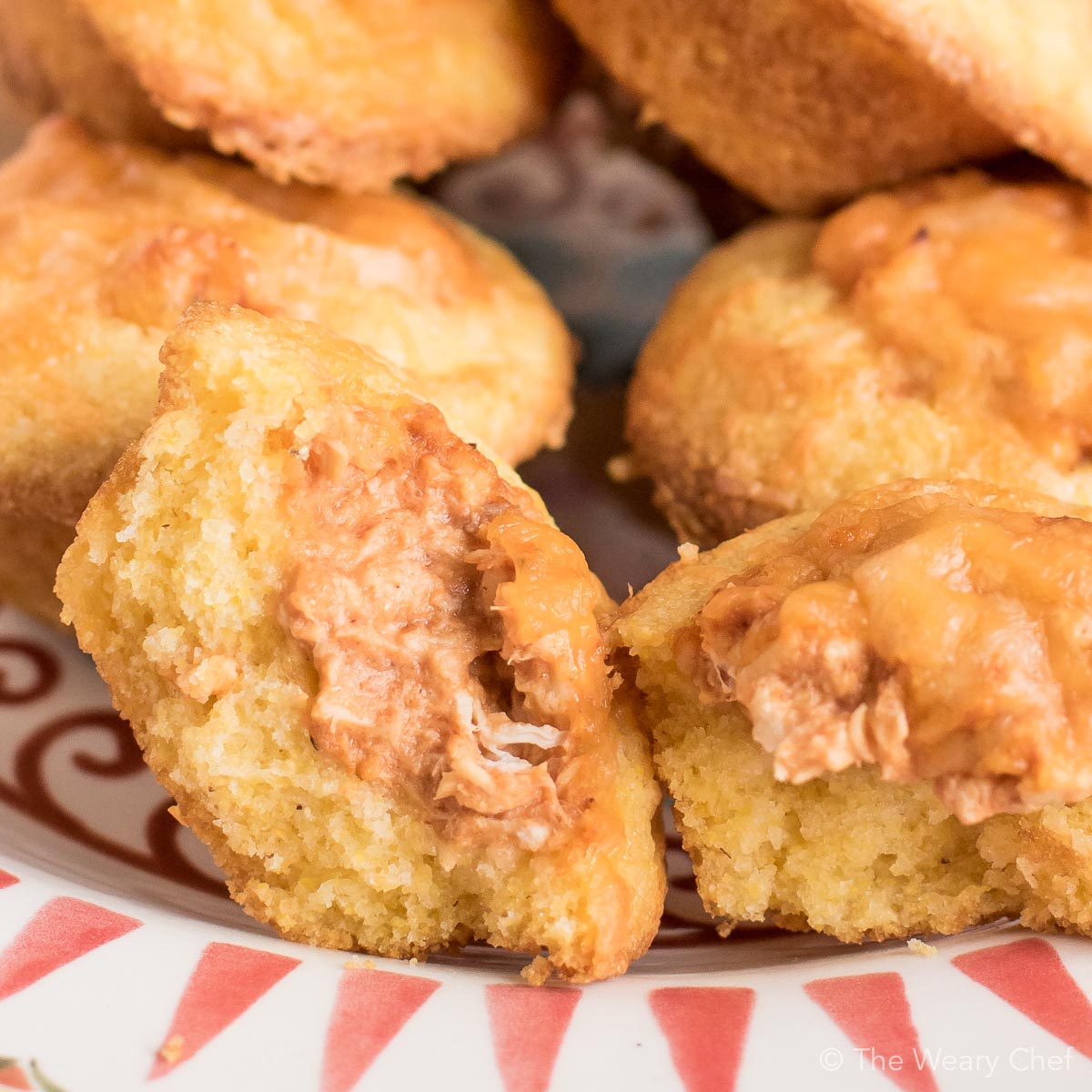 Mini cornbread muffins are stuffed with a creamy BBQ chicken mixture and topped with shredded cheese. Perfect easy recipe for tailgating, parties, and potlucks!