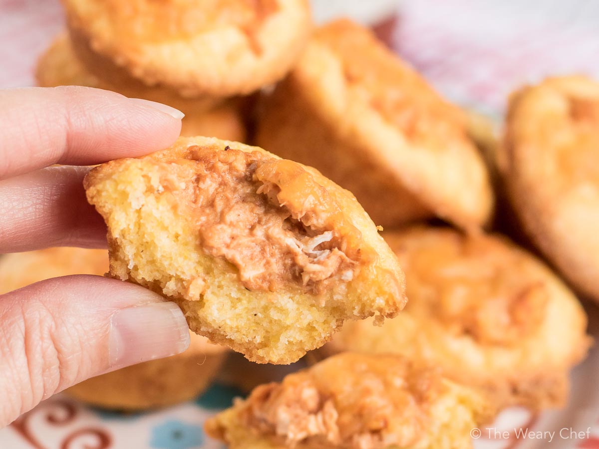 Mini cornbread muffins are stuffed with a creamy BBQ chicken mixture and topped with shredded cheese. Perfect easy recipe for tailgating, parties, and potlucks! #bbq #chicken #recipe