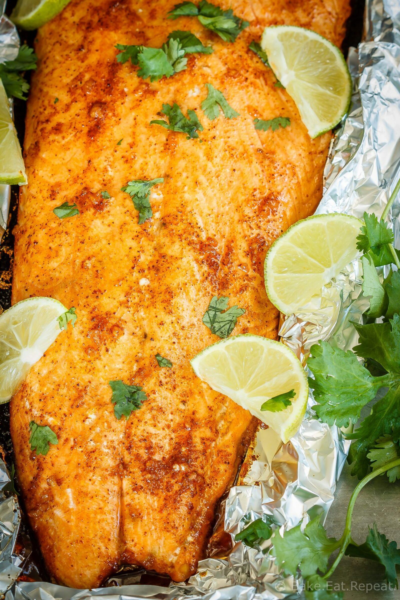 Learn how to bake salmon in foil with lime and chili for a tasty 30 minute meal that the whole family will love! #salmon #sheetpan #seafood