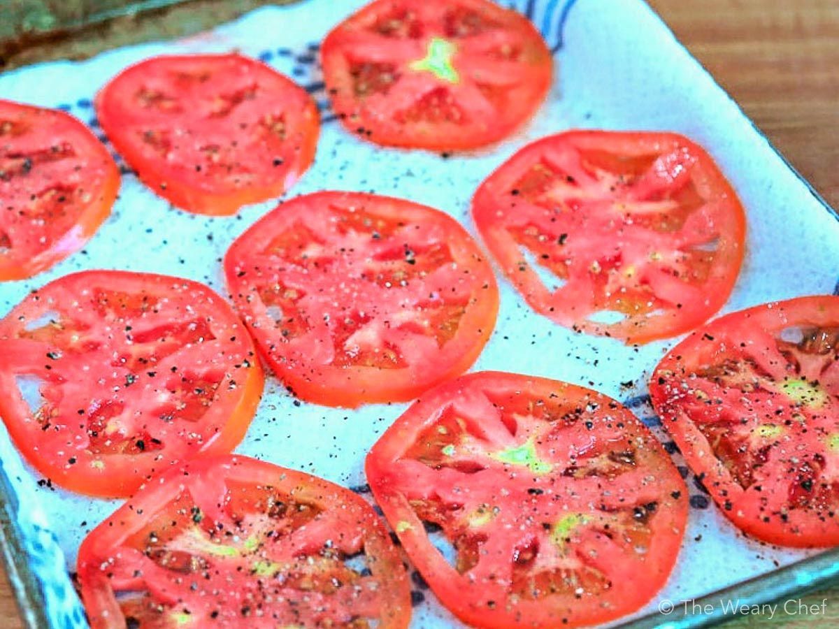 Salt and drain your tomatoes before adding them to pizza.