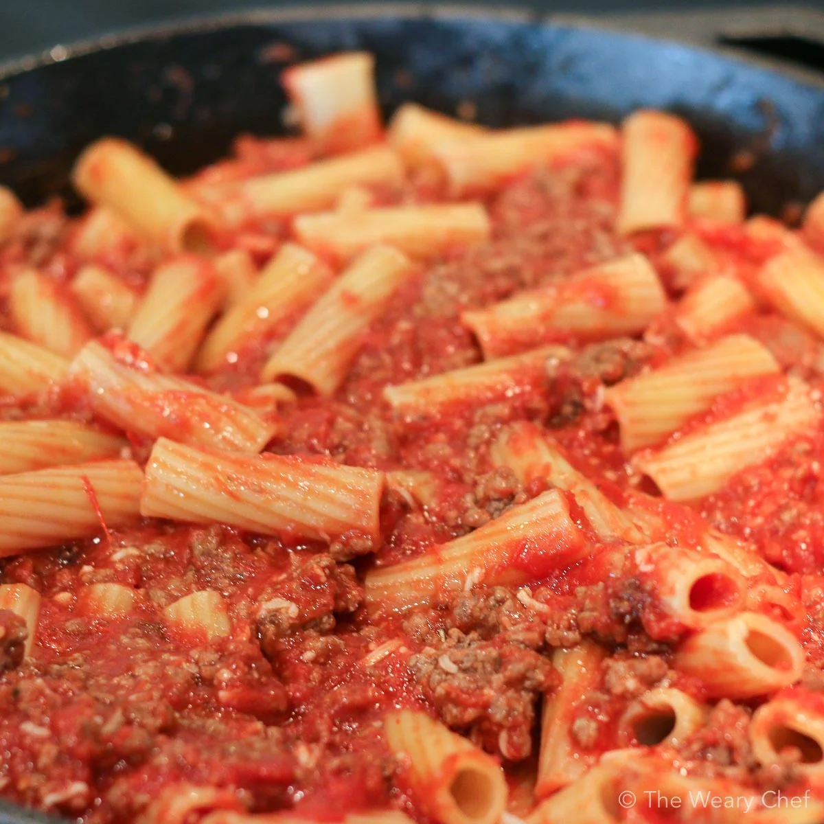 This cheesy skillet pasta is loaded with hearty beef, homemade tomato sauce, and plenty of mozzarella cheese. It is sure to be a favorite dinner recipe in your kitchen! #pasta #skillet #cheese #comfortfood