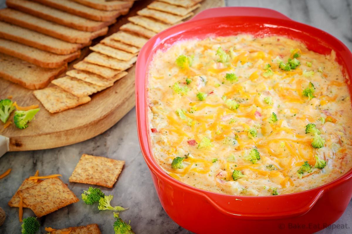 This hot, baked broccoli cheese dip is easy to mix up and can be made ahead of time. Everyone will love this appetizer served with crackers, chips or veggies! #dip #broccoli #cheese #cheddar #appetizer