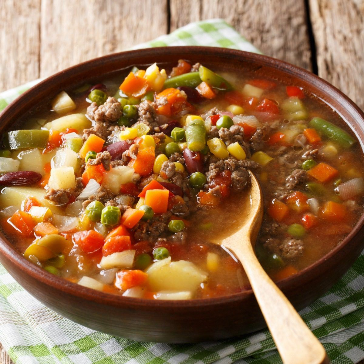 This easy hamburger soup is loaded with ground beef and vegetables. Make it in the slow cooker or in about a half hour! #beef #soup #vegetables #healthy