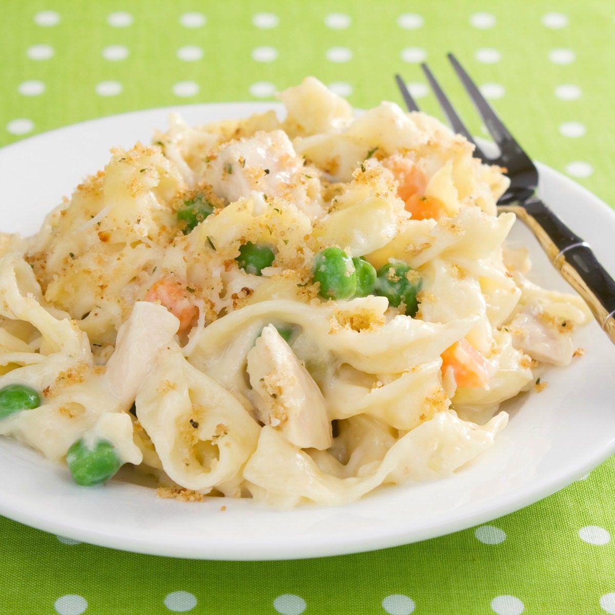 This creamy chicken noodle casserole is a satisfying dinner your family will love! #potluck #casserole #chickennoodle #comfortfood