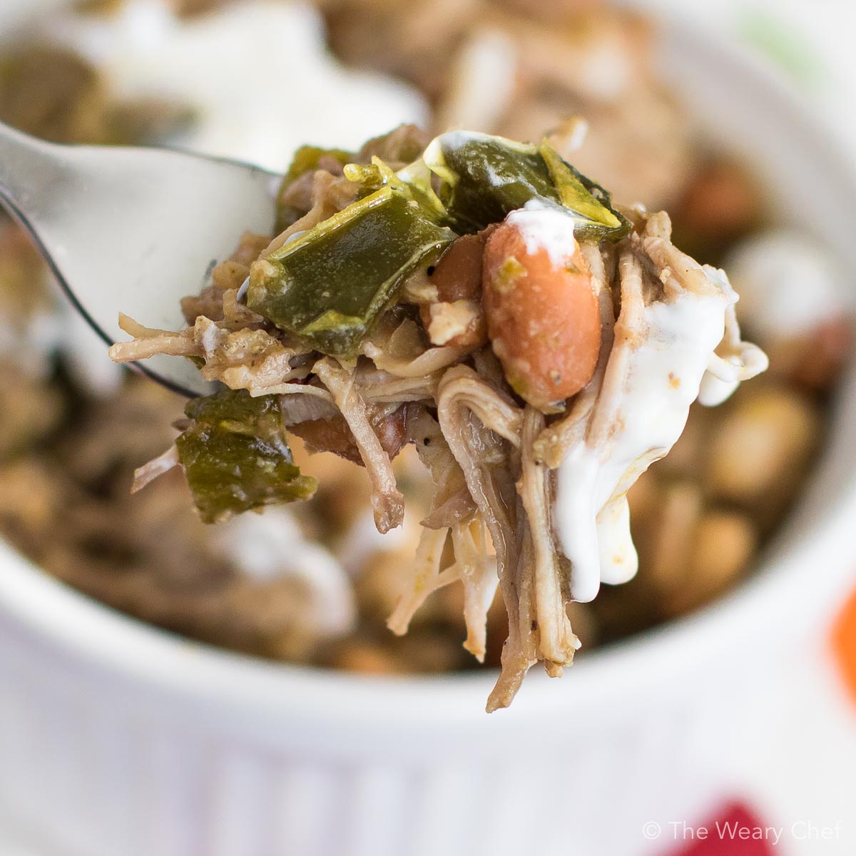 Slow Cooker Pork and Beans with Poblano Peppers is a super simple dinner recipe that tastes incredible! #pork #crockpot #slowcooker #beans