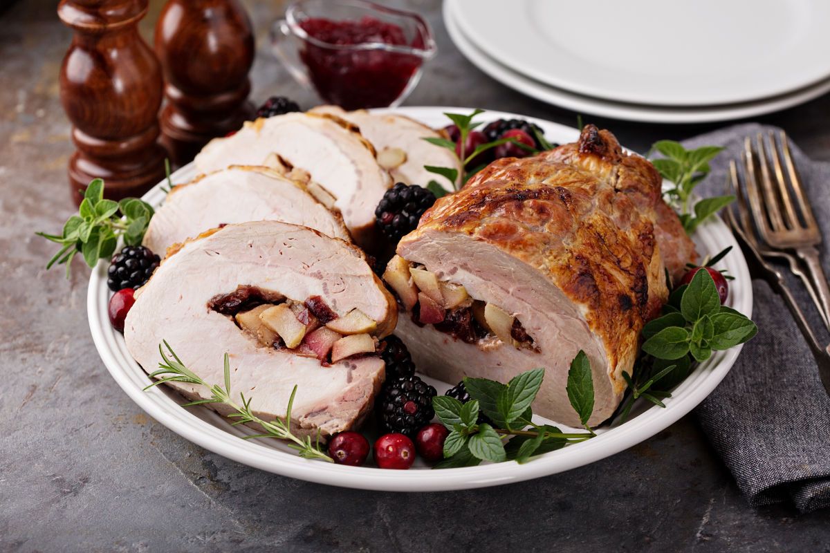 This beautiful Apple Cranberry Stuffed Pork Tenderloin only needs a few ingredients and is perfect for holiday meals. #pork #cranberry #apple #dinnerrecipe #holidayrecipe