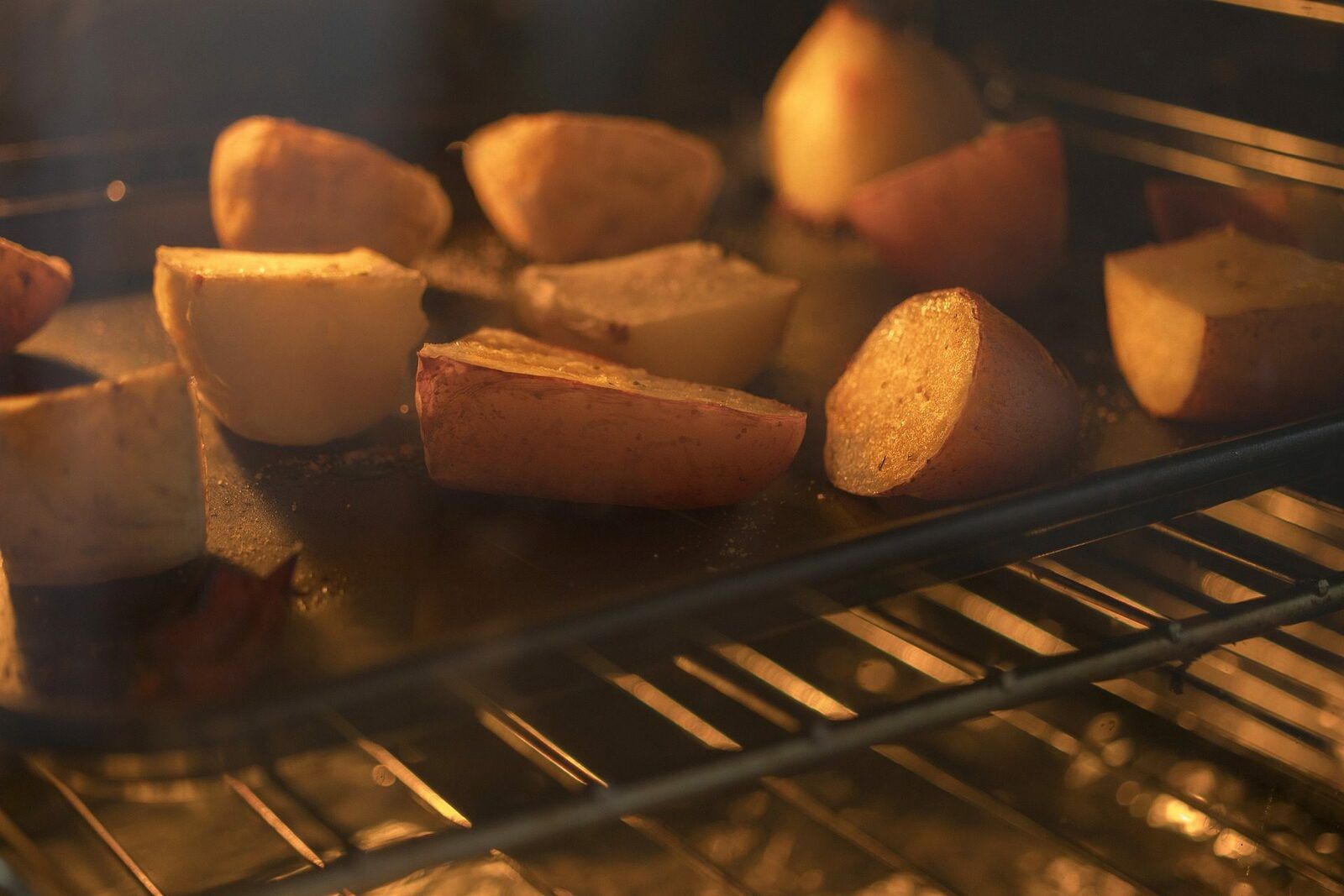 Potatoes in an oven as part of a sheet pan dinner recipe