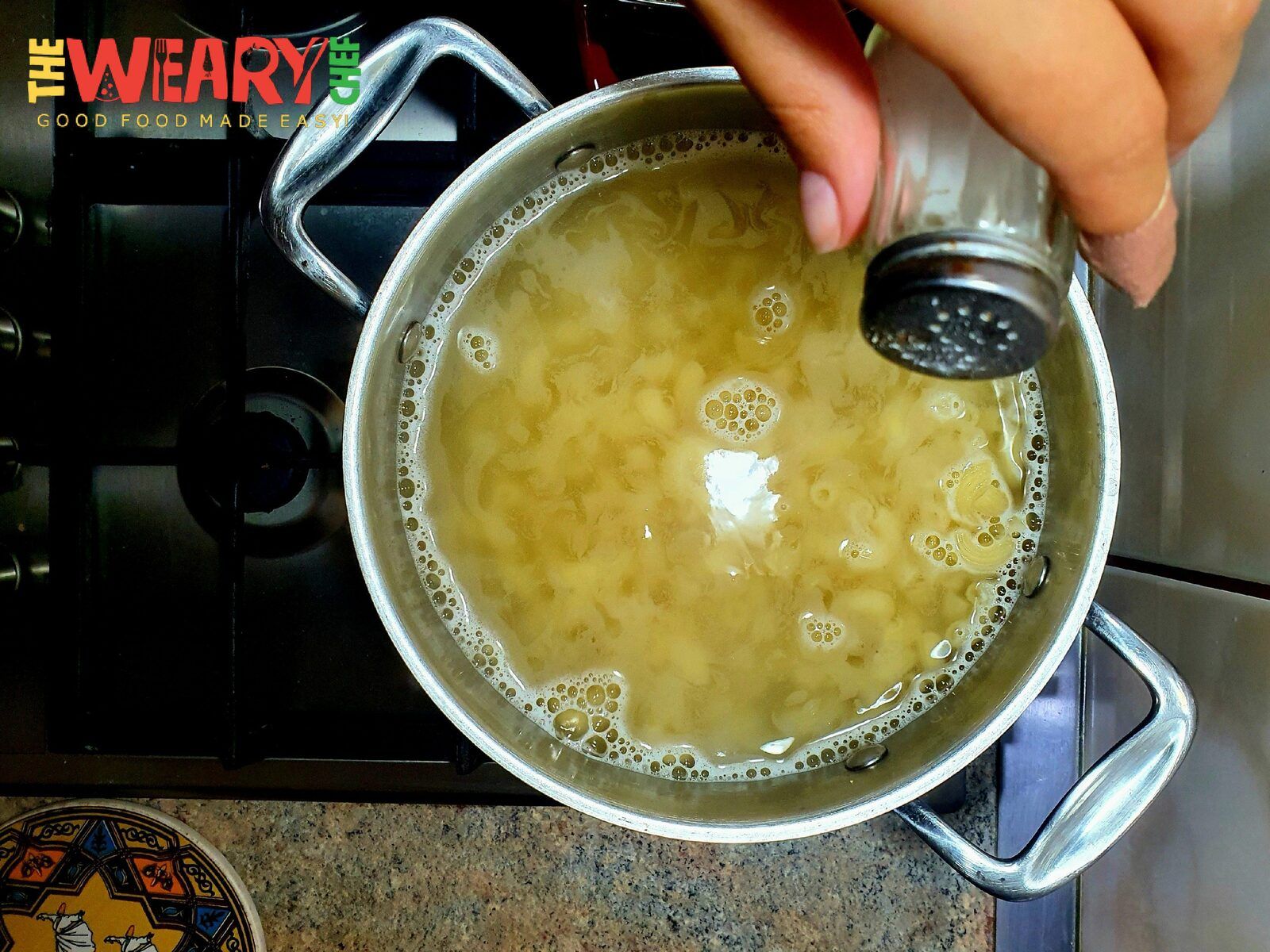 macaroni in boiling water with salt
