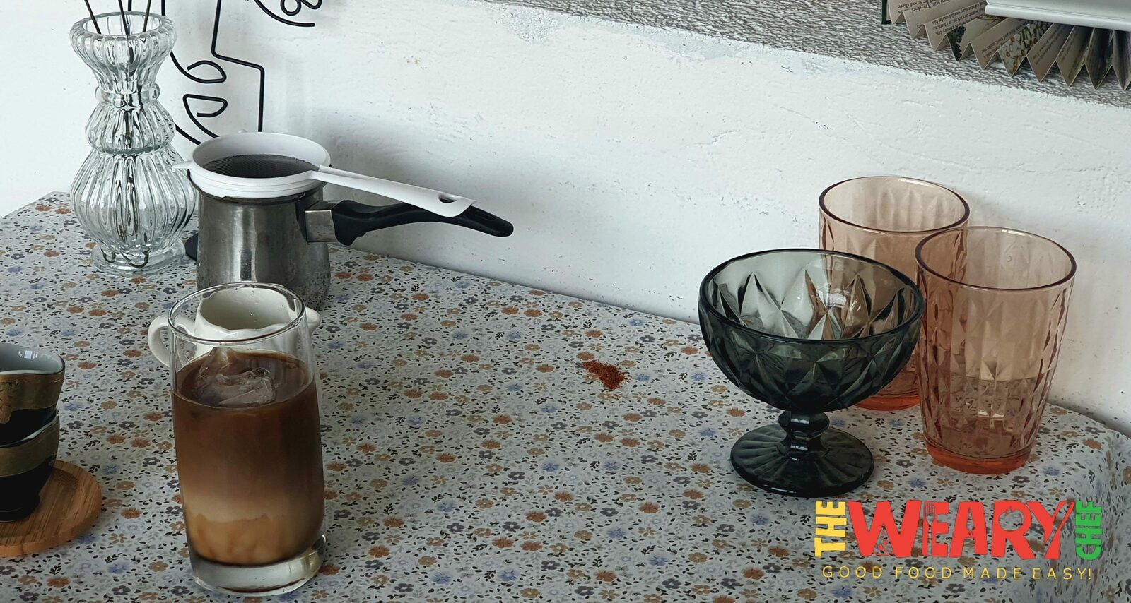 glasses, coffee pot, and iced coffee in a glass