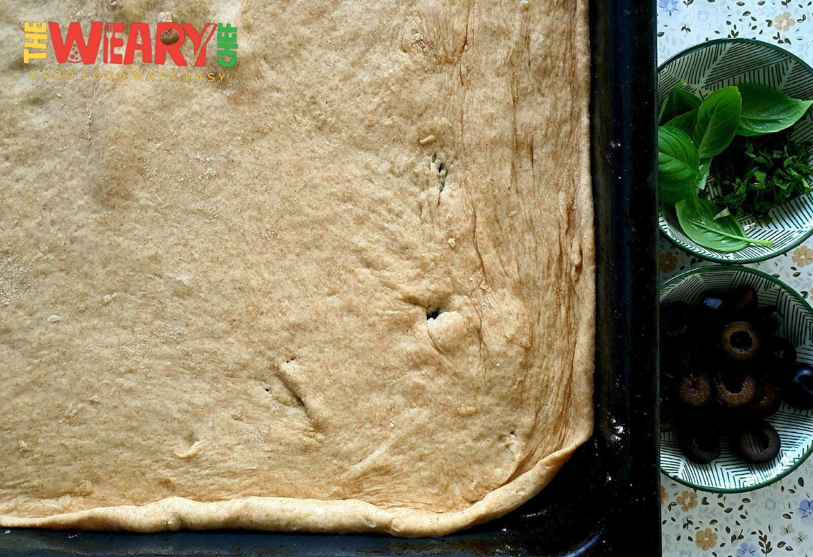 pizza dough in baking pan