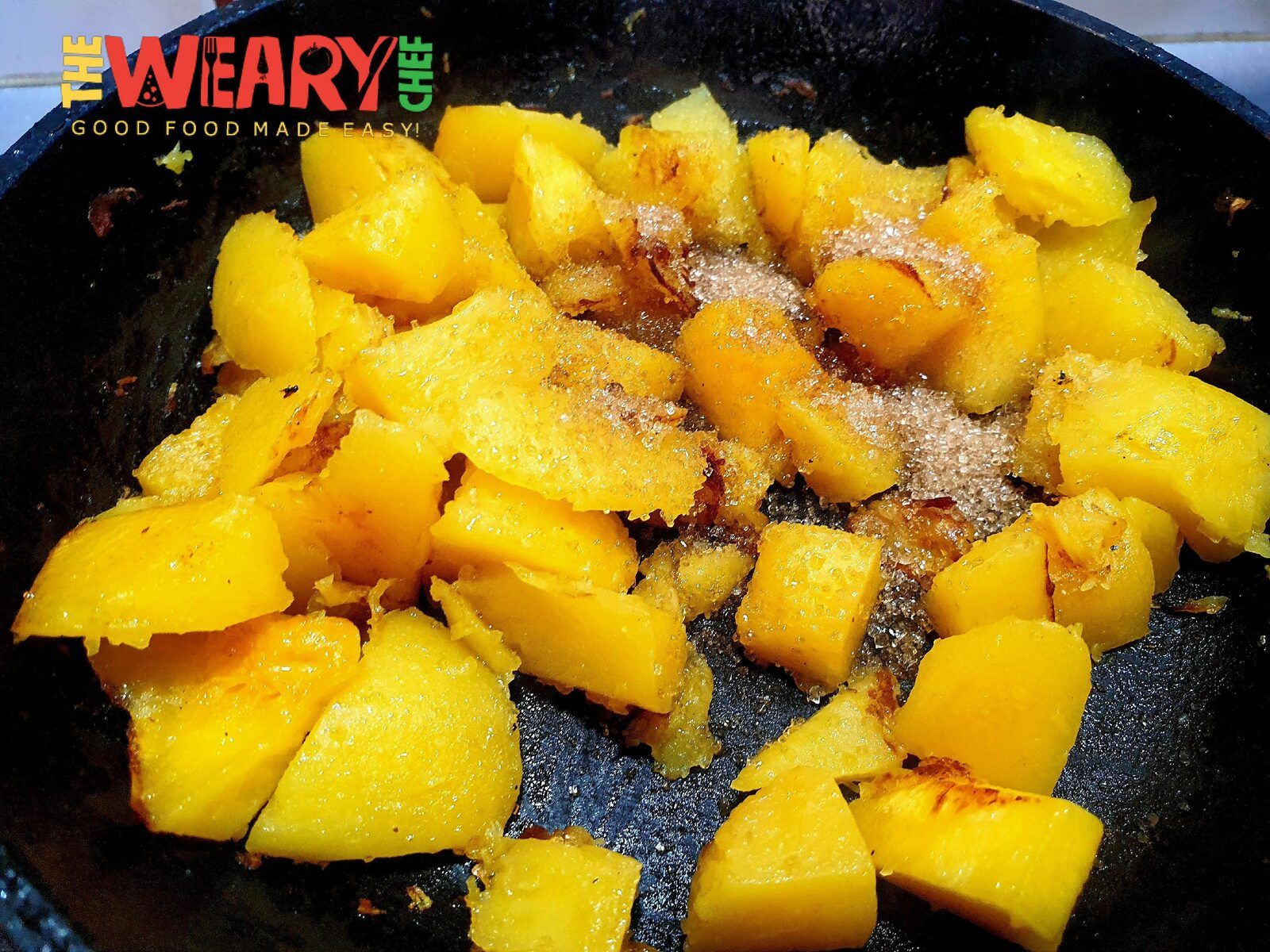 butternut pieces in pan with sugar