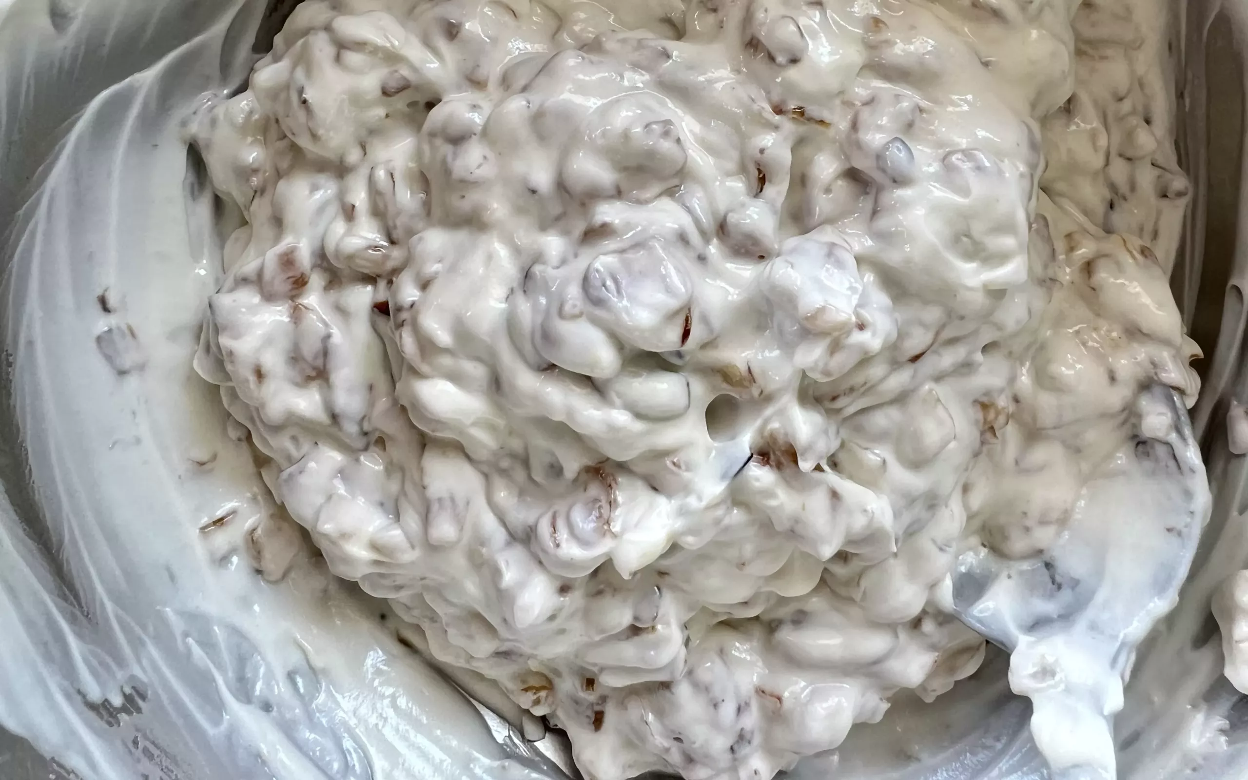 fully mixed sour cream and onion dip, ready to be served